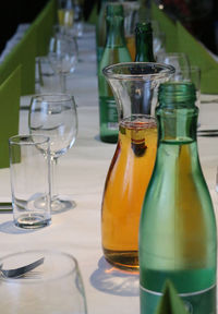 Close-up of drinks in bottles on dining table