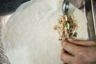 High angle view of person preparing food