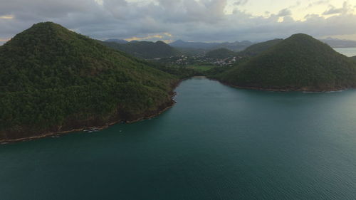 Scenic view of mountains against cloudy sky