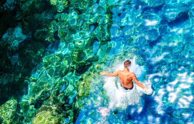 High angle view of man swimming in pool