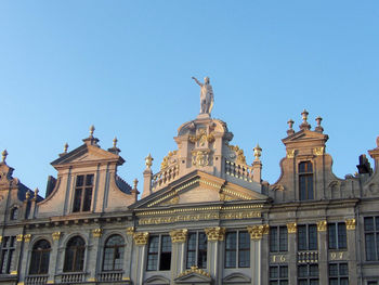 Historical buildings with statue with blue sky