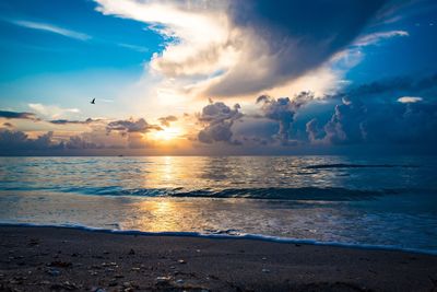 Scenic view of sea against sky at sunset