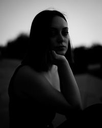 Portrait of young woman looking away