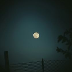 Low angle view of moon in sky at night