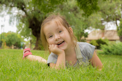 Portrait of smiling girl on grass