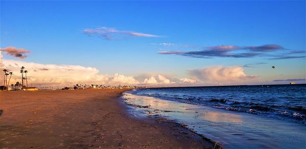 Scenic view of beach against sky during sunset