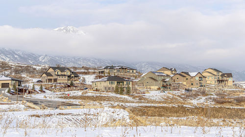 Townscape against sky during winter