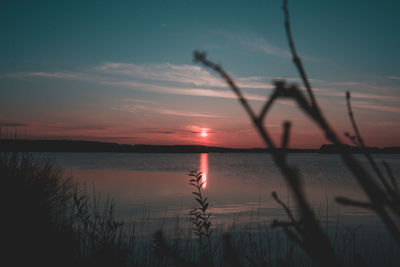 Scenic view of lake against sky during sunset