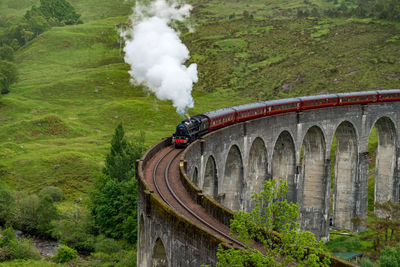 Jacobite steam train on glennfinnan viaduct