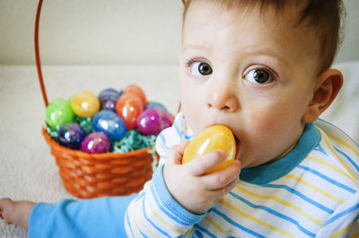 Close-up portrait of cute boy eating food