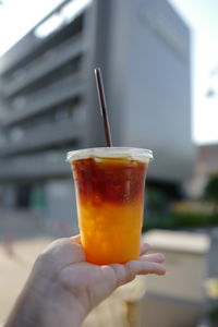 Close-up of hand holding drink