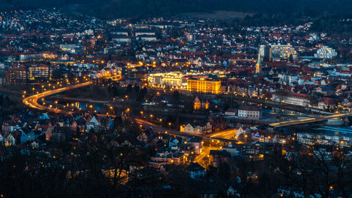 High angle view of illuminated cityscape against sky