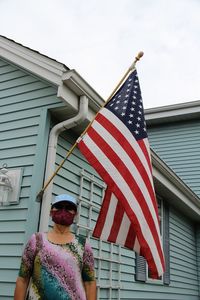 Low angle view of woman admiring united states flag