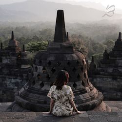 Ancient temple against building