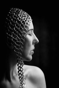 Portrait of woman with metal cap iv