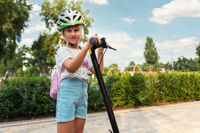 Portrait of girl standing outdoors