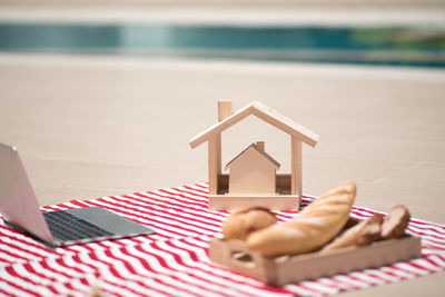 Close-up of laptop on table at beach