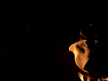 Close-up of bonfire against black background