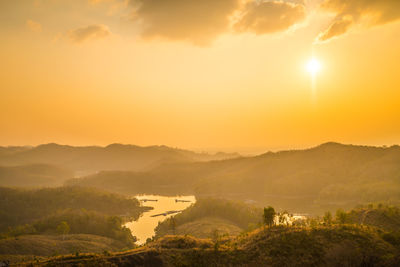 Scenic view of landscape against sky during sunset