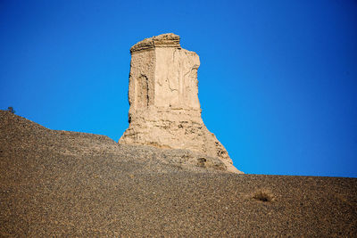 Low angle view of castle against blue sky