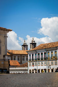 Buildings in city against sky