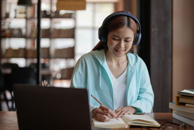 Businesswoman working at table