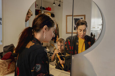 Woman in front of mirror