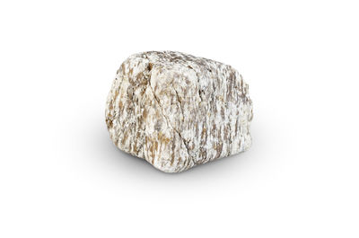 Close-up of rock against white background