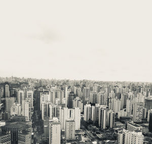 High angle view of modern buildings in city against clear sky