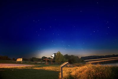 Scenic view of field against sky at night