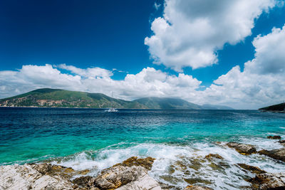 Scenic view of sea against blue sky