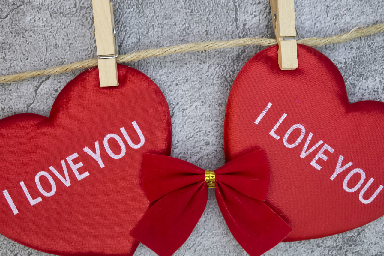 CLOSE-UP OF HEART SHAPE MADE OF HANGING FROM TEXT