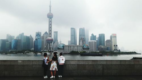 Urban skyline against sky