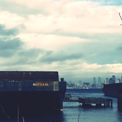 Scenic view of harbor against sky