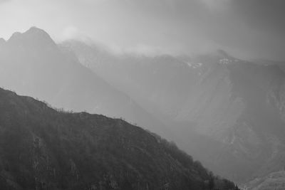 Scenic view of mountains against sky during winter