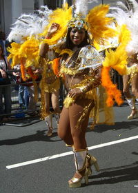 Full length of woman standing by railing