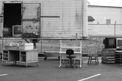 Abandoned furniture and television sets on street