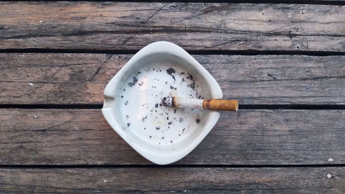 High angle view of cigarette on table