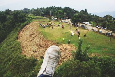 People on field against sky