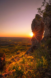 Scenic view of landscape against sky during sunset