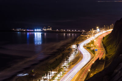 High angle view of light trails on road at night