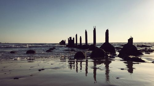 Scenic view of beach against clear sky