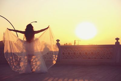 Woman against sky during sunset