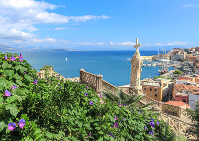 Scenic view of sea and buildings against sky