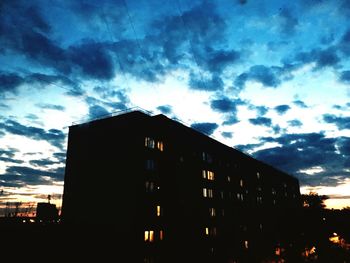 Low angle view of illuminated building against sky