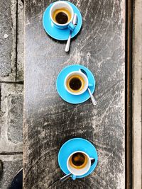 Directly above shot of coffee cups on table