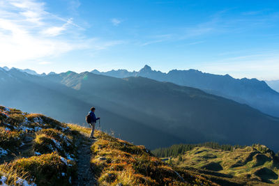 Man on mountain against sky