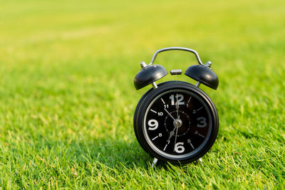 Close-up of clock on field
