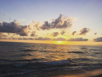 Scenic view of calm sea at sunset