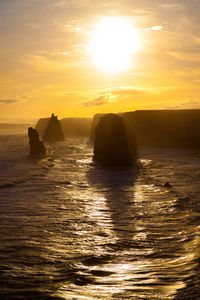 Scenic view of the twelve apostles against sky during sunset